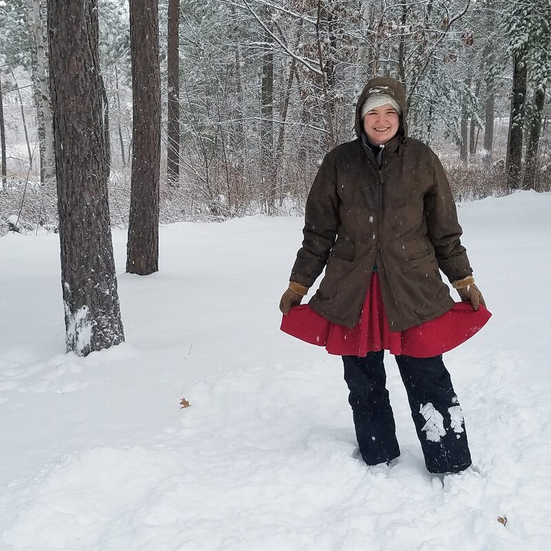 Christine in dress and snow gear